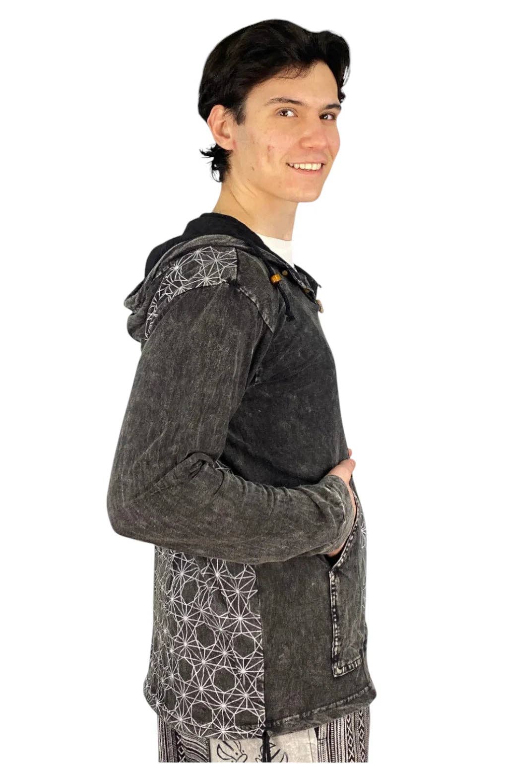A man wearing a dark gray, acid-washed hooded sweatshirt with a black collar and white geometric line patterns on the shoulders and lower front, shown from a side profile against a white background.
